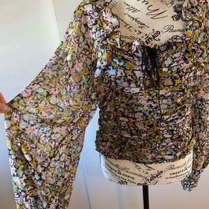 Free people NWT Rauched front with tie Elastic back puff sleeve blouse.